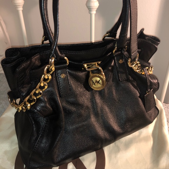 Classic Michael Kors black shoulder hobo bag with gold hardware. - Picture 1 of 4